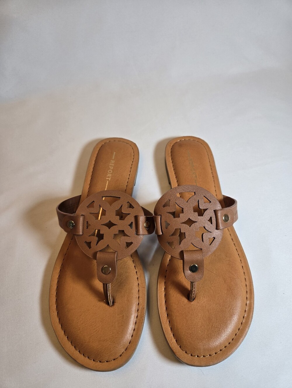 Report Tan Laser-Cut Medallion Thong Sandals
